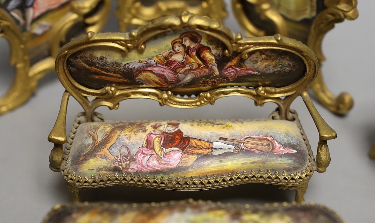 A suite of Viennese enamelled miniature furniture: 3 fold screen, table, salon sofa, a pair of armchairs and 2 dining chairs